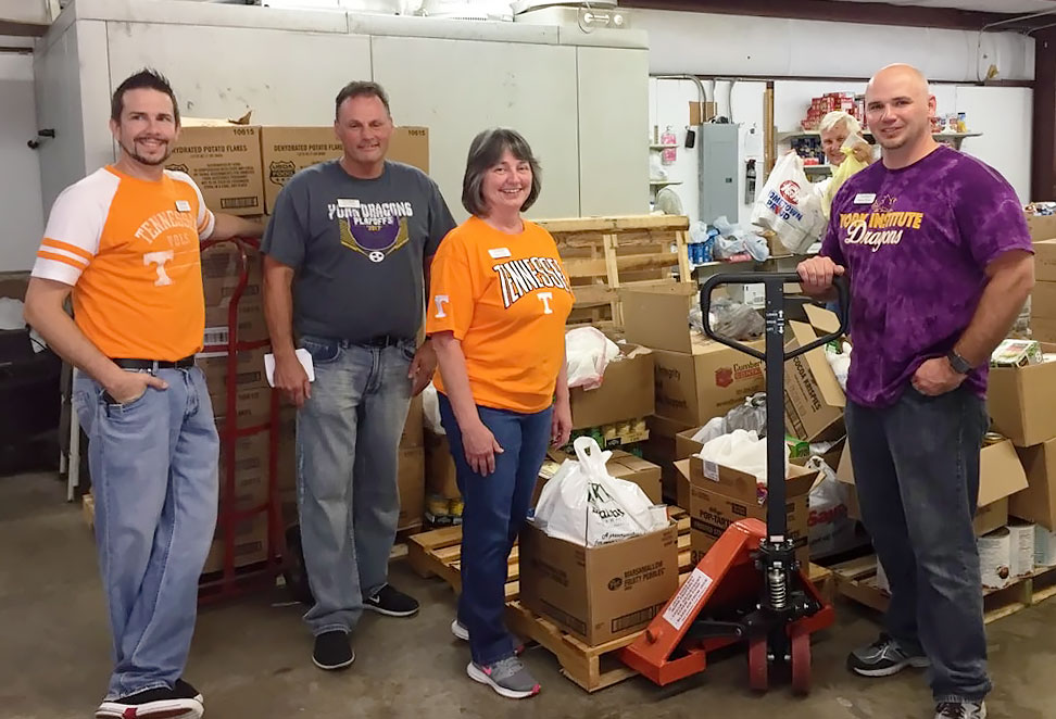 FVB team members load pallets of food after a successful Tailgate-a-Palooza!